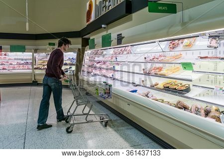A Guy Checking Out The Meat Section At Publix Where Most Poultry/ Chicken Is Out Of Stock Due To Hig