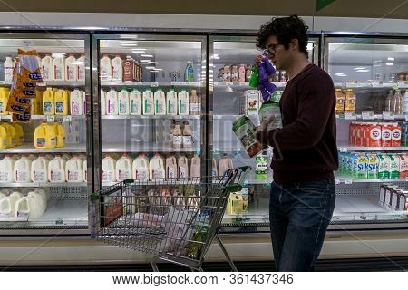 Empty Refrigerated Shelves At Publix Featuring Dairy Food Shortage Including Milk, Yogurt, And Sour