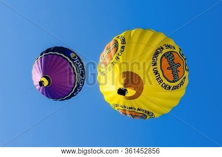 Mondovì, Italy - January 5, 2019: Hot-air Balloons Flying In The Blue Clear Sky Just After The Take 