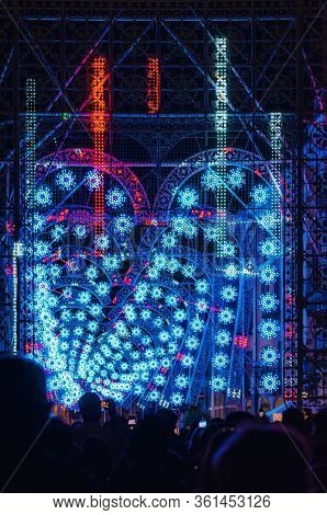 Cuneo, Italy - July 12, 2019: Crowd Looking A Light And Music Performance At Night During Cuneo Illu