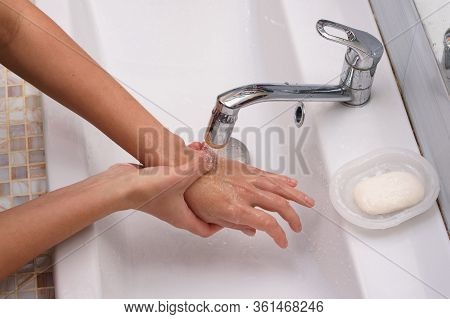 The Girl Brought The Burn Place Under A Stream Of Water For First Aid