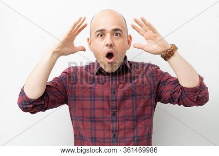 Caucasian Bald Man With Mouth Open Looking Shocked And Surprised With His Mind Blown