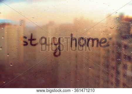 Foggy Glass On Window With Written Finger Text Yellow Color Stay Home Concept Photo With Copy Space 