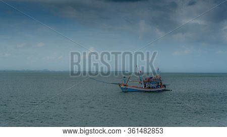Traditional Thai Fishing Boat With Outriggers Out In The Gulf Of Thailand Off The Coast Of Pythiu
