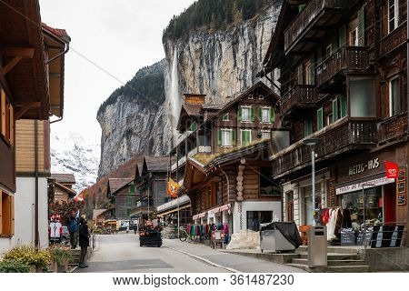 Lauterbrunnen, Interlaken, Switzerland - November 7, 2019: Old Street And Wooden Buildings With 300m