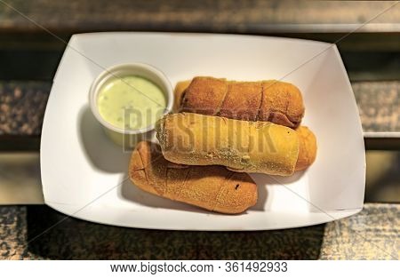 Top View Of A Paper Plate With Tequenos, Popular Venezuela Fried Bread Cheese Sticks Stuffed With Qu