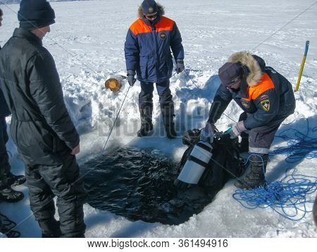 Lake Baikal, Russia - March 12, 2020: Rescue Divers Conduct Training Camps On Lake Baikal. Divers In