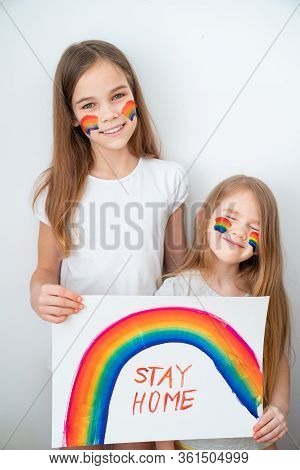 Two Girls With Blond Hair Drew A Rainbow And A Poster Stay Home. Flashmob Chasetherainbow.