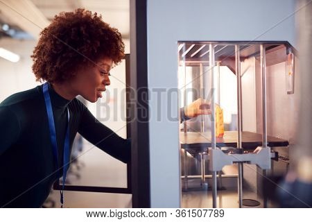 Female College Student Studying Engineering Using 3D Printing Machine