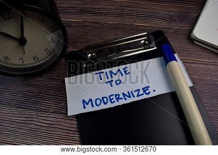 Time To Modernize Write On Sticky Notes Isolated On The Table.