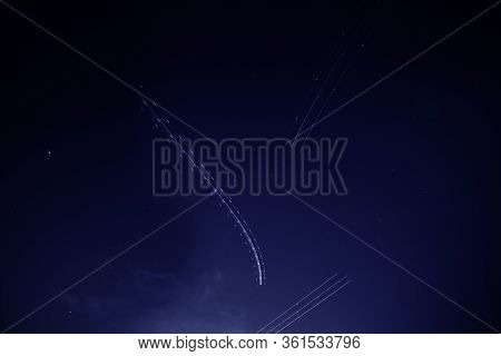 Multiple Flying Airplane Light Trails Blinking In The Dark Sky Long Exposure Photography