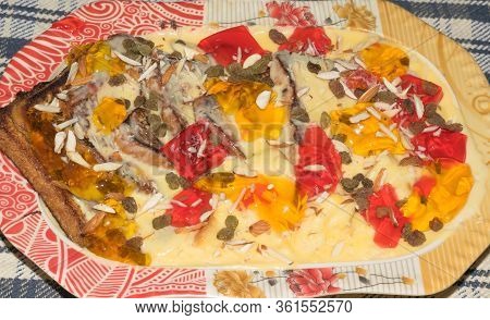 Custard With Jelly Pieces, A Traditional Delicious Dessert Made With Custard ,jelly And Dry Fruits.s