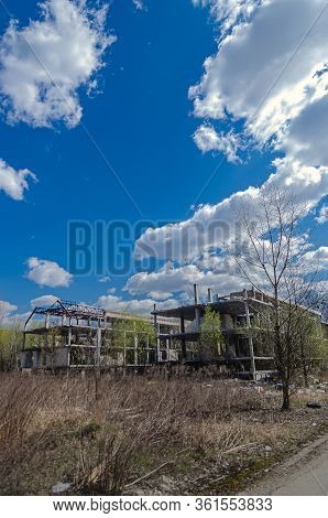 Abandoned Construction Site Of A Residential Complex. Skeletons Of Apartment Buildings. Construction