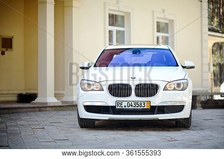 Grodno, Belarus, May 2013: Modern Luxury Bmw 750li Xdrive Car Front View Parked On Stone Paved Parki