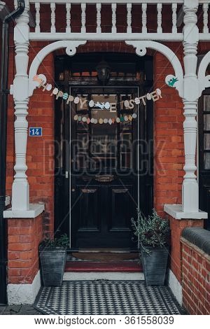 London, Uk - April 12, 2020: Happy Easter Garland On A Facade Of A Traditional Edwardian House In Lo