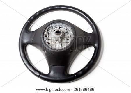 Black Leather Shiny Steering Wheel With A Metal Frame A Separate Part Of The Car On A White Isolated