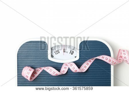 Scales And Measuring Tape Isolated On White Background