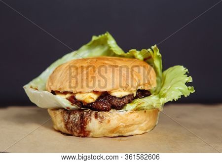 Juicy Burger With Chicken And Lamb Meat On A Dark Background