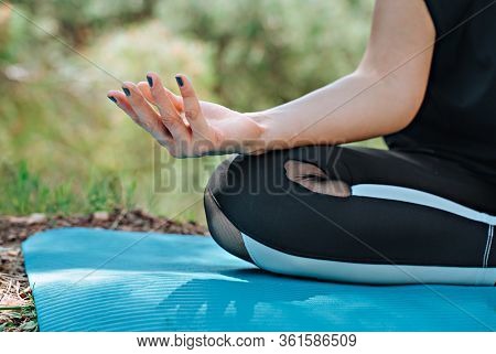 Close Up Hands. Woman Do Yoga In Forest. Healthy And Yoga Concept