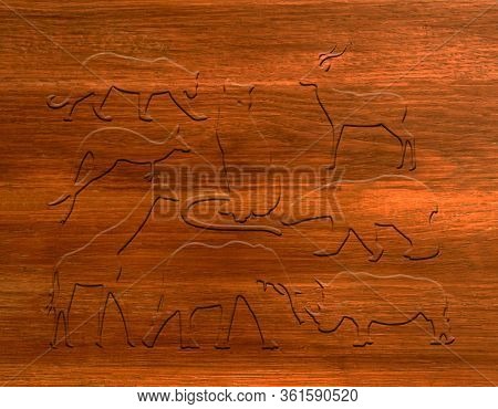 Foto Different Animals On A Brown Board