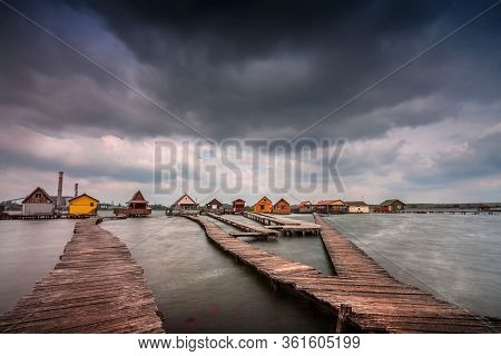 Bokod Floating Village With Piers And Fishing Wooden Cottages, In One Windy Morning. Bokod Lake, Hun