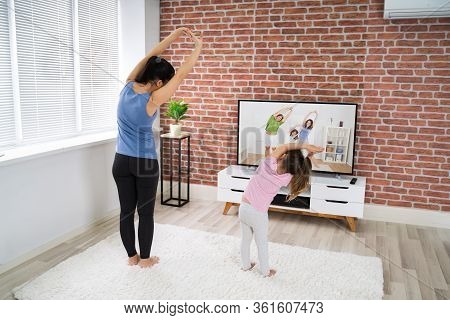 Fit Family Doing Home Online Yoga Fitness Exercise