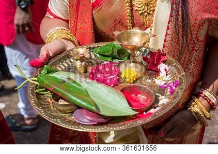 A Women Holding A Borondala (pooja Thali For Worshipping God) In Sindur Khela At A Puja Pandal On Th