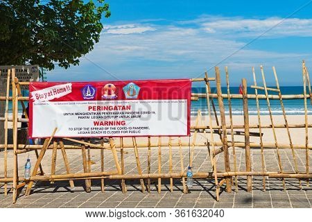 Kuta, Bali Island, Indonesia - April 16, 2020: Warning Banner With Sign 