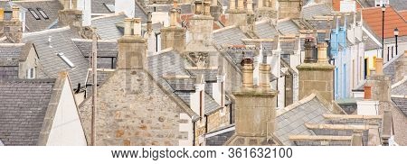 Old Croft Houses In Cullen, Fishing Village On Moray Firth, Scotland. Cullen Viaduct In The Backgrou