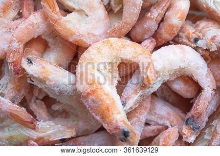 Frozen Big Shrimps Close Up. Raw Frozen Shrimp Background. Pile Of Frozen Shrimps Background