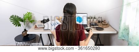 Attractive Young Beautiful Asian Woman Working With Laptop And Document While Sitting At The Indoors