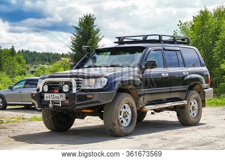 Chelyabinsk Region, Russia - June 12, 2012: Black Offroad Car Toyota Land Cruiser 105 In The City St