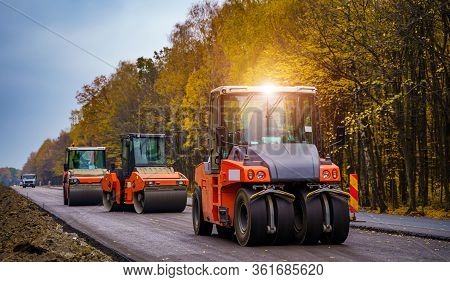 Tandem Vibration Roller Compactor Working On Asphalt Pavement, Selective Focus On Road Repair.