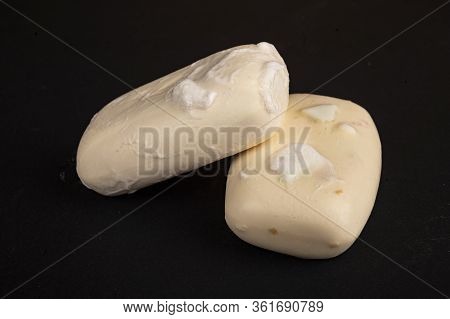 Two Pieces Of Toilet Soap On A Black Background. Close Up. Washing Hands With Soap Is A Prevention O