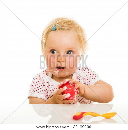 Cute Infant Girl Learining To Eat With Spoon
