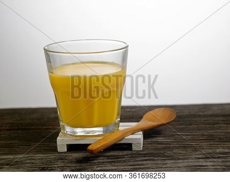 cup of mango puddding on white background ready to eat