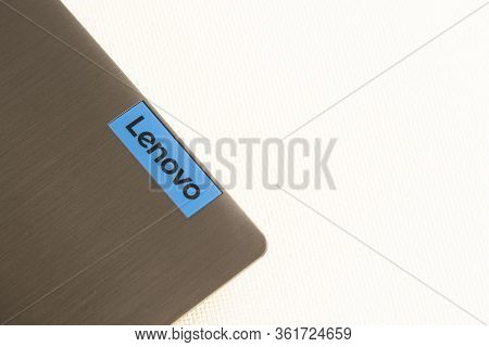 Back Side Of Laptop With Lenovo Logo Isolated On White Background.