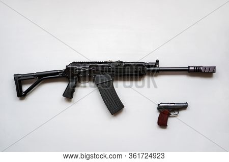 Close-up Of A Boar Machine Gun And Pistol On A White Background. Isolated.