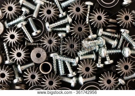 Mechanical Components On Black Background. Industrial Objects