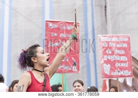 Caba, Buenos Aires / Argentina; March 9, 2020: International Womens Day. Young Woman Shouting Slogan