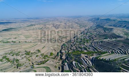 Aerial View Of Terraced Farm Field Mass Production During Summer Dry Season In Tianshui, Gansu Provi