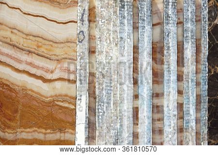 A Pile Of Sawn Slabs Of Natural Stone Is In The Warehouse, A Beautiful Stone With Stripes Is Called 
