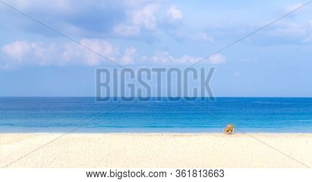 A Single Bamboo Chair At The Empty And Exotic Of Sin Htauk Beach, Myanmar.