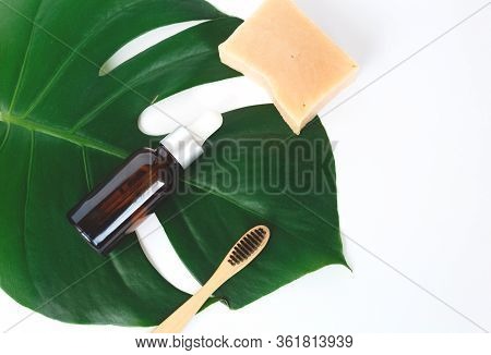 The Concept Of Zero Waste. Bamboo Toothbrush, Solid Shampoo And Serum