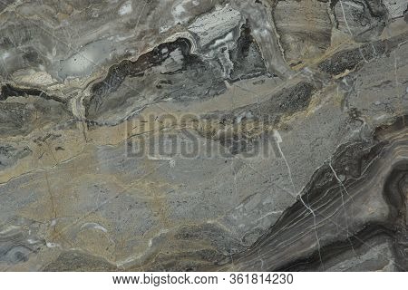 Background From A Natural Stone Of Gray-white Color With A Beautiful Pattern Is Called Arabescato Or