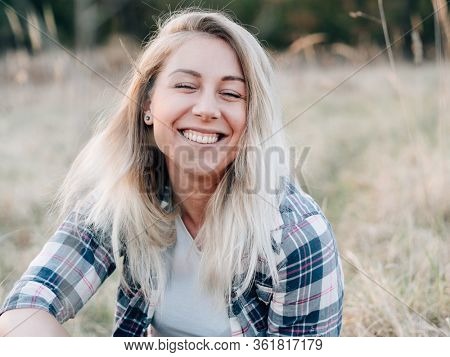 Happy woman smiling outddor. Carefree llife.