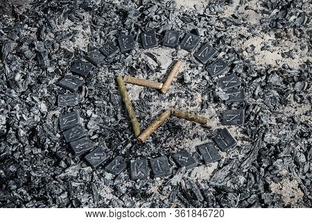 Norse Rune Pertho On Ashes Backgorund Inside The Circle Of 24 Norse Runes