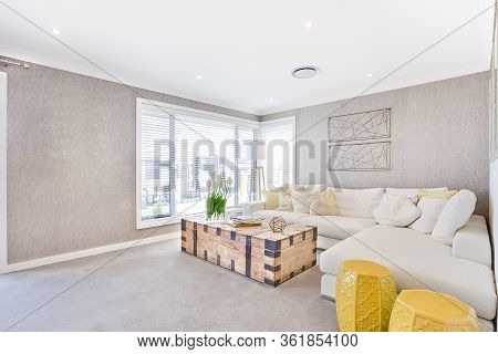 Sunlight Illuminated Living Room Interior With Sofa And Pillows With Windows, The Wooden Box With Me