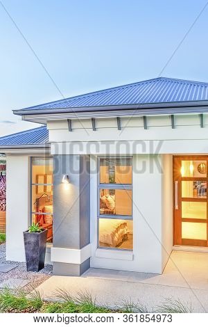 Luxury House Front Walls With Garden, Luxury Furniture Can See Inside Of Rooms, Sky Is Clear Without