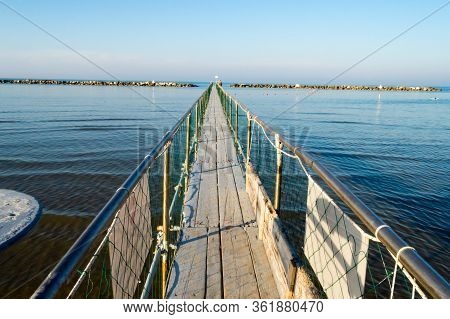 Pier In Stainless Steel And Wood Allow The Boarding Of Tourists On The Boats Of Igea Marina Near Rim